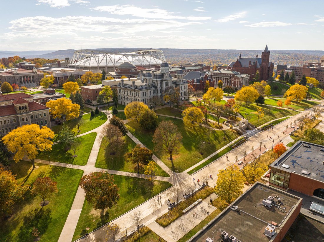An aerial view of Syracuse University campus with fall foliage.