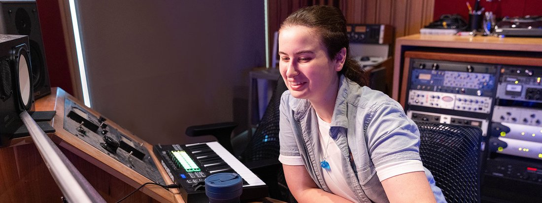 Student working in a recording studio.