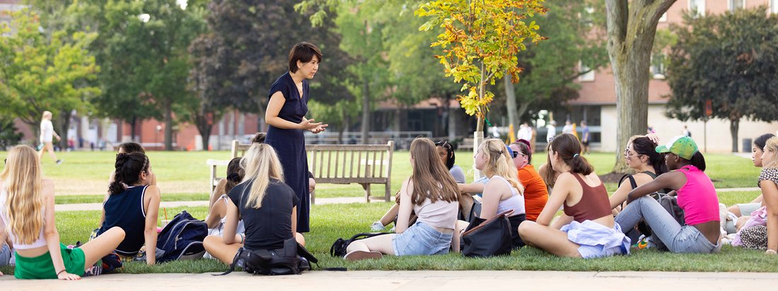 Students work with their instructor on the quad.