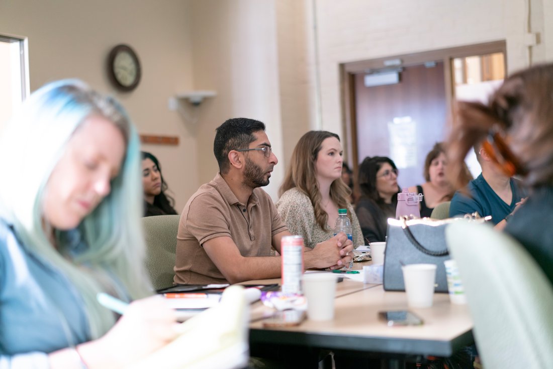 Students seated in a classroom listening to a lecture