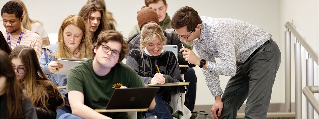 Mathematics students take courses across the sub-disciplines of mathematics. Here, Professor Pawel Grzegrzolka works with calculus students in a 200-level course.