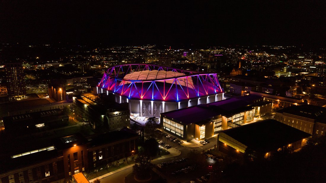 Drone shot of the JMA Wireless Dome at night.