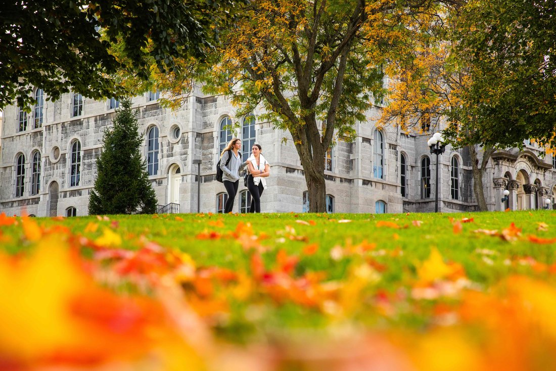 Students walking on campus in the fall.